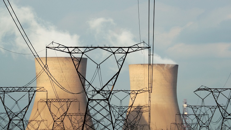 FILE PHOTO: Cooling towers at a coal-based power station owned by state power utility Eskom in Duhva, South Africa, February 18, 2020.